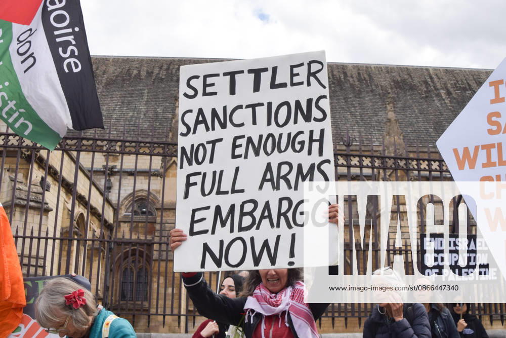 An activist holds a placard stating Settler sanctions not enough, full arms embargo now as protesters gather in Parliament Square in support of Palestine and against what the protesters call a pro-Israel and Zionist influence in UK politics. London United Kingdom - ZUMAv130 20260909_zip_v130_101