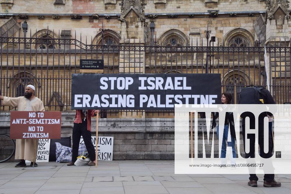 Pro-Palestine protest in London, UK - 9 Sep 2026 Protesters hold a Stop Israel erasing Palestine banner during the demonstration. Protesters gathered in Parliament Square in support of Palestine and against what the protesters call a pro-Israel and Zionist influence in UK politics. London United Kingdom