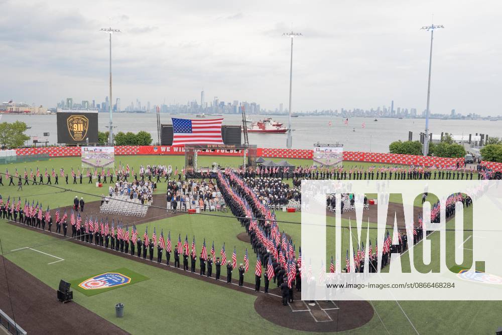 Members of FDNY walked with 343 American flags for each member who sacrificed their live on September 11, 2001 during memorial service to commemorate 25th anniversary of terrorist attack on World Trade Center in New York. Service was held at FerryHawks Stadium of Staten Island Borough, New York, NY on September 9, 2026. FDNY members, families of those how perished on that day and who died after of illnesses related to their work in the rescue and recovery efforts, members of fire departments from around the country as well as firefighters from Italy and France attended the service. New York USA - ZUMAr339 20260909_znp_r339_004
