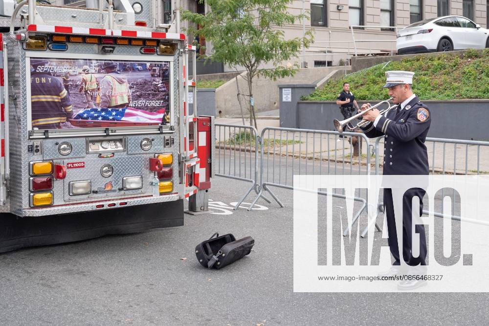 Member of FDNY plays trumpet as members of FDNY walked with 343 American flags for each member who sacrificed their live on September 11, 2001 during memorial service to commemorate 25th anniversary of terrorist attack on World Trade Center in New York. Service was held at FerryHawks Stadium of Staten Island Borough, New York, NY on September 9, 2026. FDNY members, families of those how perished on that day and who died after of illnesses related to their work in the rescue and recovery efforts, members of fire departments from around the country as well as firefighters from Italy and France attended the service. New York USA - ZUMAr339 20260909_znp_r339_011