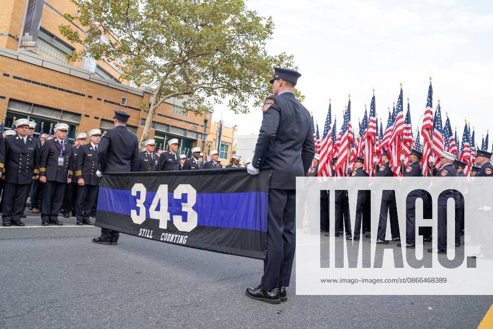 Members of FDNY walked with 343 American flags for each member who sacrificed their live on September 11, 2001 during memorial service to commemorate 25th anniversary of terrorist attack on World Trade Center in New York. Service was held at FerryHawks Stadium of Staten Island Borough, New York, NY on September 9, 2026. FDNY members, families of those how perished on that day and who died after of illnesses related to their work in the rescue and recovery efforts, members of fire departments from around the country as well as firefighters from Italy and France attended the service. New York USA - ZUMAr339 20260909_znp_r339_015