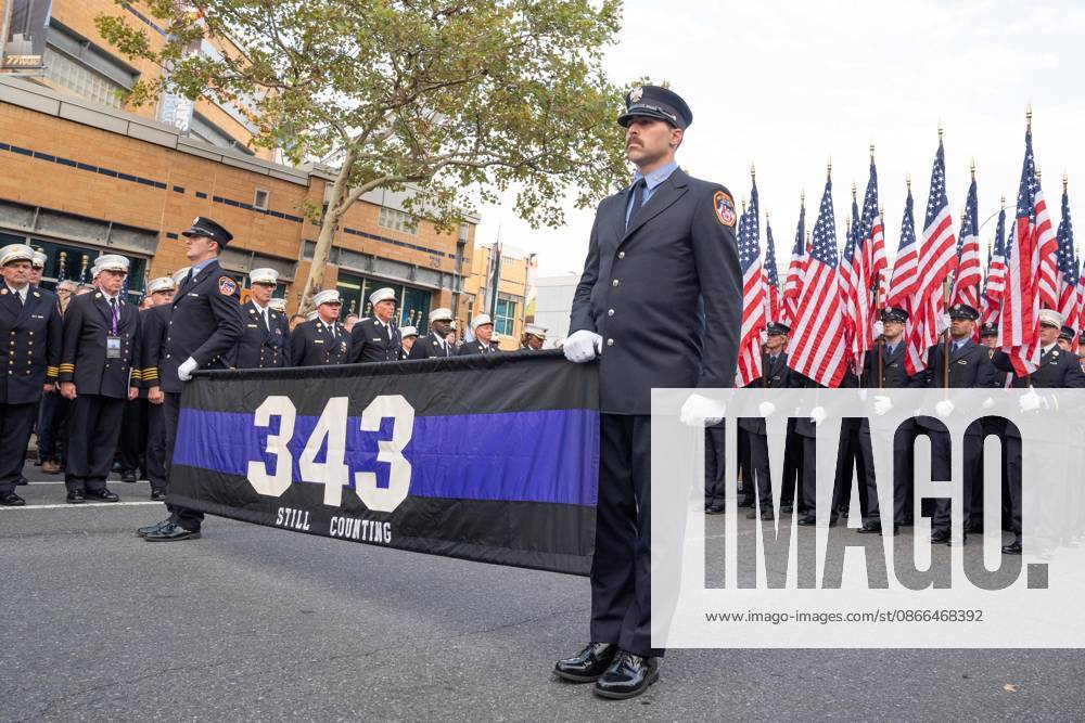Members of FDNY walked with 343 American flags for each member who sacrificed their live on September 11, 2001 during memorial service to commemorate 25th anniversary of terrorist attack on World Trade Center in New York. Service was held at FerryHawks Stadium of Staten Island Borough, New York, NY on September 9, 2026. FDNY members, families of those how perished on that day and who died after of illnesses related to their work in the rescue and recovery efforts, members of fire departments from around the country as well as firefighters from Italy and France attended the service. New York USA - ZUMAr339 20260909_znp_r339_016