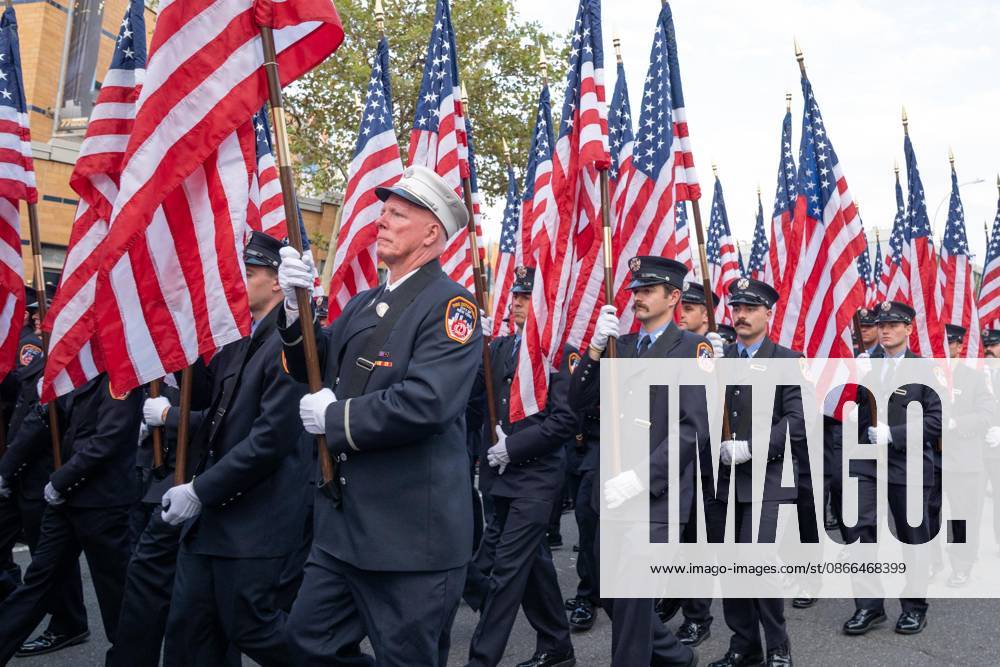 Members of FDNY walked with 343 American flags for each member who sacrificed their live on September 11, 2001 during memorial service to commemorate 25th anniversary of terrorist attack on World Trade Center in New York. Service was held at FerryHawks Stadium of Staten Island Borough, New York, NY on September 9, 2026. FDNY members, families of those how perished on that day and who died after of illnesses related to their work in the rescue and recovery efforts, members of fire departments from around the country as well as firefighters from Italy and France attended the service. New York USA - ZUMAr339 20260909_znp_r339_017