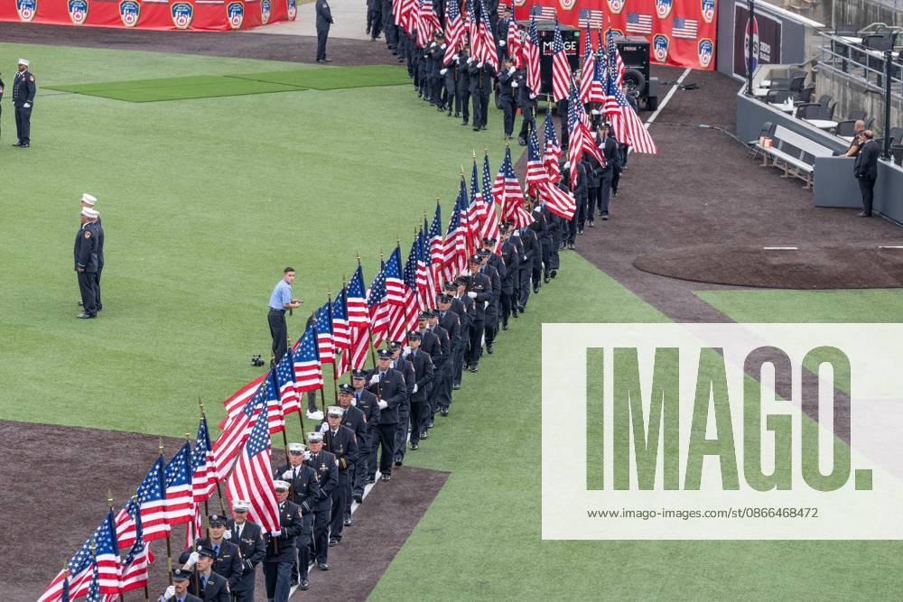 Members of FDNY walked with 343 American flags for each member who sacrificed their live on September 11, 2001 during memorial service to commemorate 25th anniversary of terrorist attack on World Trade Center in New York. Service was held at FerryHawks Stadium of Staten Island Borough, New York, NY on September 9, 2026. FDNY members, families of those how perished on that day and who died after of illnesses related to their work in the rescue and recovery efforts, members of fire departments from around the country as well as firefighters from Italy and France attended the service. New York USA - ZUMAr339 20260909_znp_r339_024