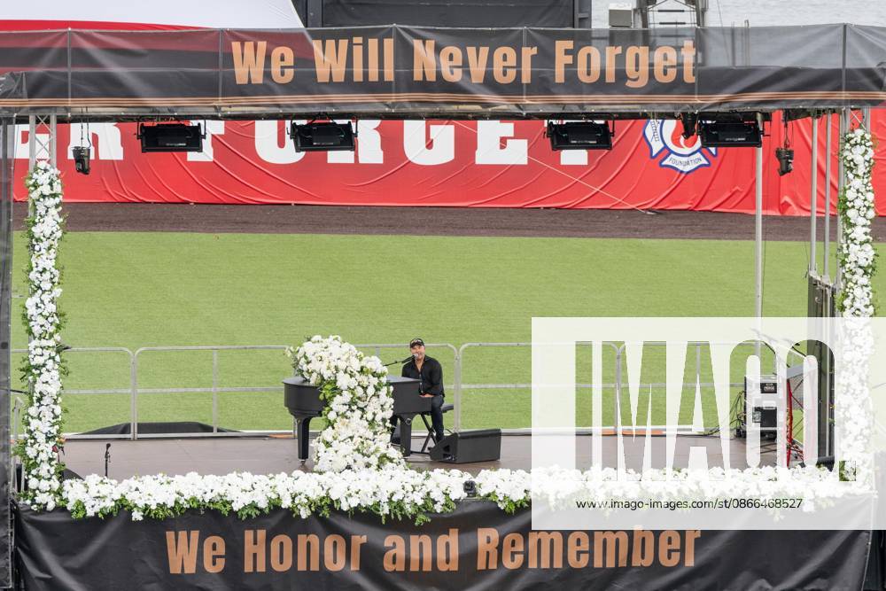 John Ondrasik aka Five for Fighting performs song Superman (It s not Easy) during memorial service to commemorate 25th anniversary of terrorist attack on World Trade Center in New York. Service was held at FerryHawks Stadium of Staten Island Borough, New York, NY on September 9, 2026. FDNY members, families of those how perished on that day and who died after of illnesses related to their work in the rescue and recovery efforts, members of fire departments from around the country as well as firefighters from Italy and France attended the service. New York USA - ZUMAr339 20260909_znp_r339_035