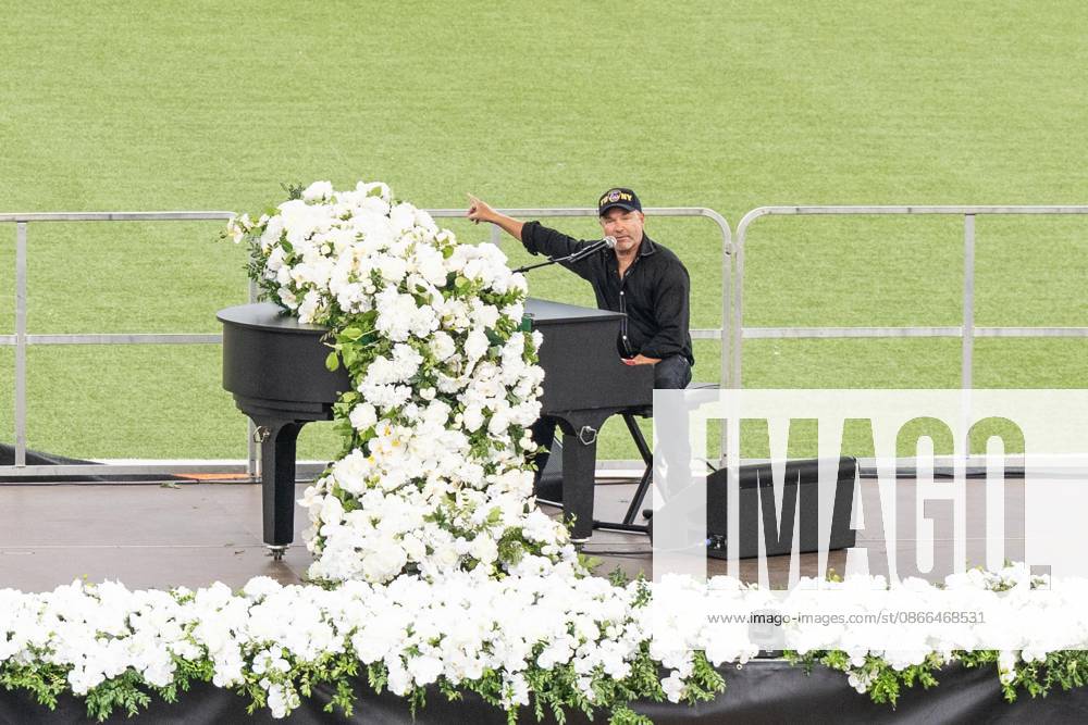 John Ondrasik aka Five for Fighting performs song Superman (It s not Easy) during memorial service to commemorate 25th anniversary of terrorist attack on World Trade Center in New York. Service was held at FerryHawks Stadium of Staten Island Borough, New York, NY on September 9, 2026. FDNY members, families of those how perished on that day and who died after of illnesses related to their work in the rescue and recovery efforts, members of fire departments from around the country as well as firefighters from Italy and France attended the service. New York USA - ZUMAr339 20260909_znp_r339_037