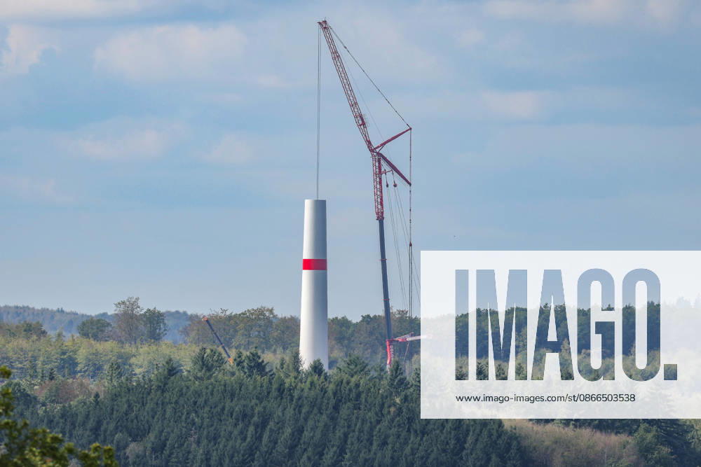 A new wind turbine is being built near Freudenberg. Work is underway. Part of the tower is already in place, and a telescopic crane stands next to it. Wind turbine construction in the Siegerland region on September 10, 2026, in Freudenberg, Germany