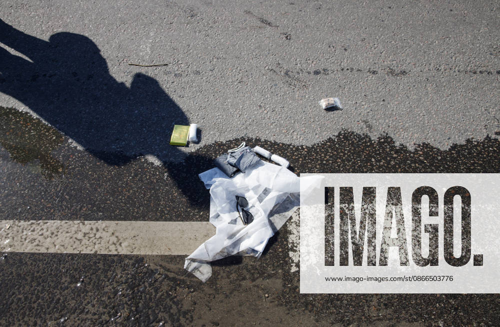 Sunglasses of a person injured in a Russian drone attack on a petrol station in the Holosiivskyi district lie on the ground, Kyiv, Ukraine, September 10, 2026. Russian forces targeted the petrol station, injuring four people. A car caught fire on the premises, and a public transport stop was also damaged.(Photo by Marianna Kotyk Ukrinform) Russian drone strikes petrol station in Kyiv’s Holosiivskyi district