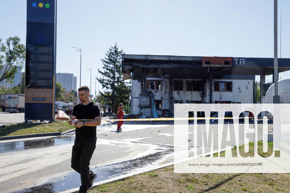 A man cordons off the premises of a petrol station attacked by a Russian drone in the Holosiivskyi district of Kyiv, Ukraine, September 10, 2026. Russian forces targeted the petrol station, injuring four people. A car caught fire on the premises, and a public transport stop was also damaged. (Photo by Marianna Kotyk Ukrinform) Russian drone strikes petrol station in Kyiv’s Holosiivskyi district
