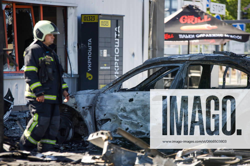 A rescuer walks past a burnt-out car at a petrol station attacked by a Russian drone in the Holosiivskyi district of Kyiv, Ukraine, September 10, 2026. Russian forces targeted the petrol station, injuring four people. A car caught fire on the premises, and a public transport stop was also damaged. (Photo by Marianna Kotyk Ukrinform) Russian drone strikes petrol station in Kyiv’s Holosiivskyi district