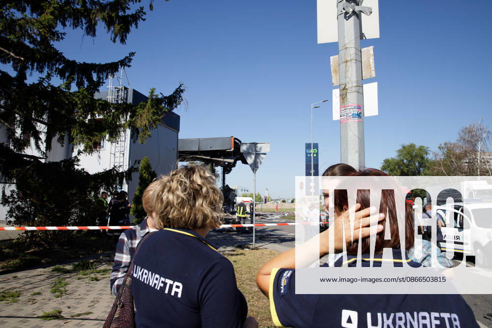 Workers and onlookers stand outside a petrol station attacked by a Russian drone in the Holosiivskyi district of Kyiv, Ukraine, September 10, 2026. Russian forces targeted the petrol station, injuring four people. A car caught fire on the premises, and a public transport stop was also damaged. (Photo by Marianna Kotyk Ukrinform) Russian drone strikes petrol station in Kyiv’s Holosiivskyi district