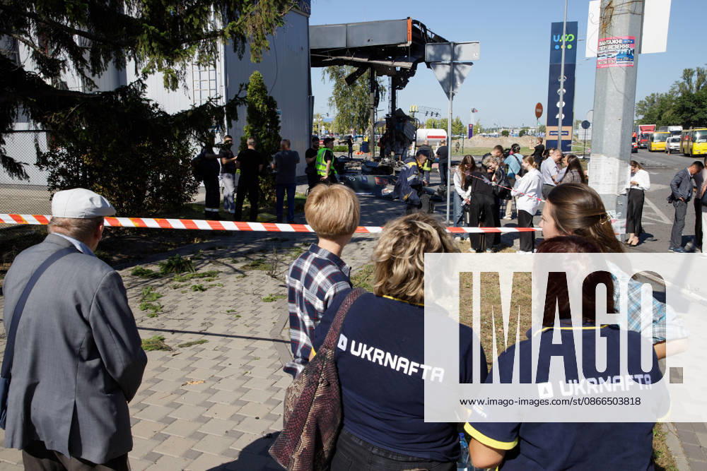 Workers and onlookers stand outside a petrol station attacked by a Russian drone in the Holosiivskyi district of Kyiv, Ukraine, September 10, 2026. Russian forces targeted the petrol station, injuring four people. A car caught fire on the premises, and a public transport stop was also damaged. (Photo by Marianna Kotyk Ukrinform) Russian drone strikes petrol station in Kyiv’s Holosiivskyi district