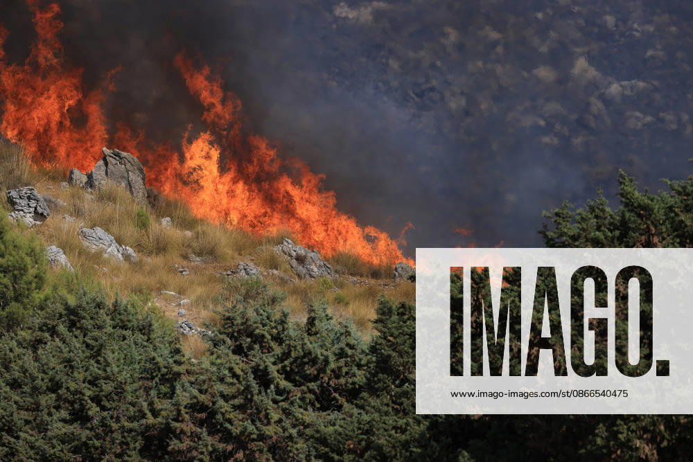 Wildfire near Palermo threatens homes in Giardinello, Sicily PALERMO, ITALY - SEPTEMBER 10: Flames and thick smoke rise from a forested area during a wildfire near Giardinello, close to Palermo on the island of Sicily, on September 10, 2026 in Palermo, Italy. The blaze began in the Carcatizzi area around midday a day earlier and spread rapidly, threatening nearby residential areas and damaging several homes. Firefighters battled the fire from the ground with fire engines and from the air with a firefighting aircraft and two helicopters. Alberto Lo Bianco Anadolu Sicily Italy. Editorial use only. Please get in touch for any other usage.