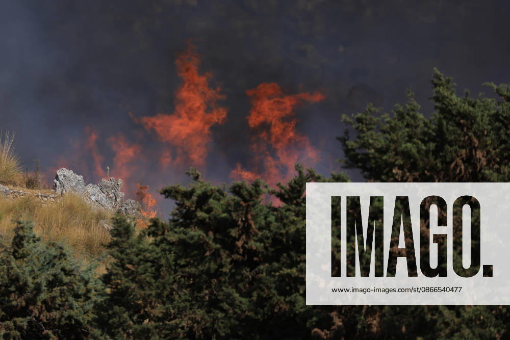 Wildfire near Palermo threatens homes in Giardinello, Sicily PALERMO, ITALY - SEPTEMBER 10: Flames and thick smoke rise from a forested area during a wildfire near Giardinello, close to Palermo on the island of Sicily, on September 10, 2026 in Palermo, Italy. The blaze began in the Carcatizzi area around midday a day earlier and spread rapidly, threatening nearby residential areas and damaging several homes. Firefighters battled the fire from the ground with fire engines and from the air with a firefighting aircraft and two helicopters. Alberto Lo Bianco Anadolu Sicily Italy. Editorial use only. Please get in touch for any other usage.