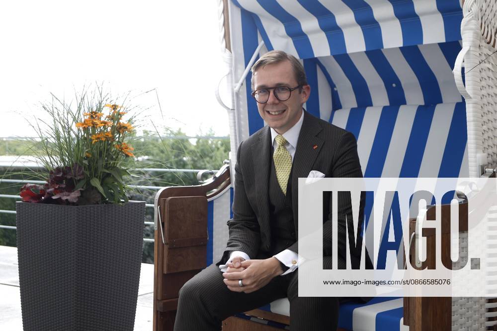 Philipp Amthor, CDU, politician, portrait at the Federal Chancellery in Berlin, Minister of State for Federal-State Relations, sitting in a beach chair from Mecklenburg-Western Pomerania on the balcony of his office, Berlin, Germany