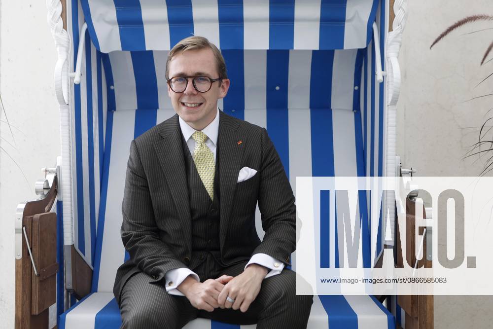 Philipp Amthor, CDU, politician, portrait at the Federal Chancellery in Berlin, Minister of State for Federal-State Relations, sitting in a beach chair from Mecklenburg-Western Pomerania on the balcony of his office, Berlin, Germany