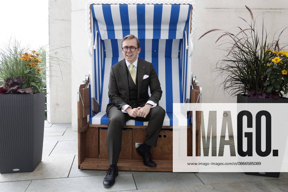 Philipp Amthor, CDU, politician, portrait at the Federal Chancellery in Berlin, Minister of State for Federal-State Relations, sitting in a beach chair from Mecklenburg-Western Pomerania on the balcony of his office, Berlin, Germany
