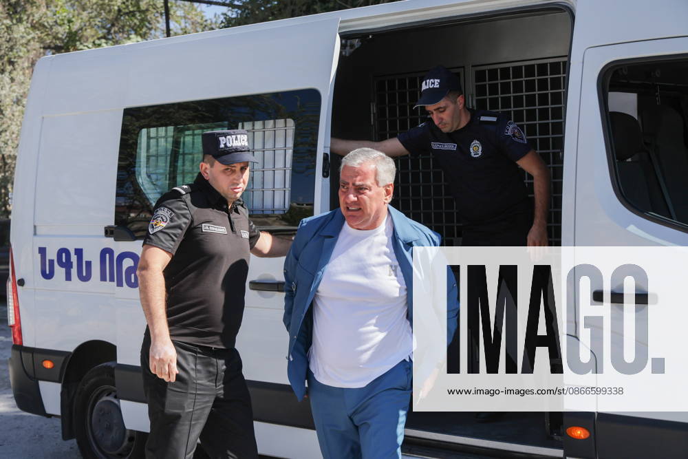 ARMENIA, YEREVAN - SEPTEMBER 11, 2026: Samvel Karapetyan (C), leader of the Strong Armenia Party, is escorted by police officers outside the Anti-Ñorruption Court building. Alexander Patrin TASS 97520231