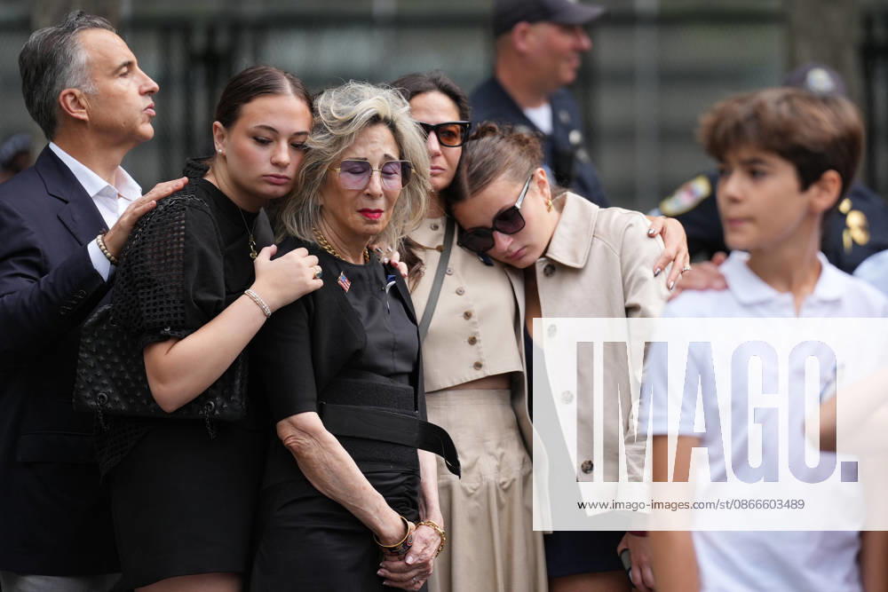 People listen to the National Anthem during a remembrance ceremony marking the 25th anniversary of the 9 11 attacks at the National September 11 Memorial & Museum at Ground Zero in New York on Friday, September 11, 2026. A total of 2,753 people died in the attack on the World Trade Center on September 11, 2001. Pool WAX20260911937 AdamxGray