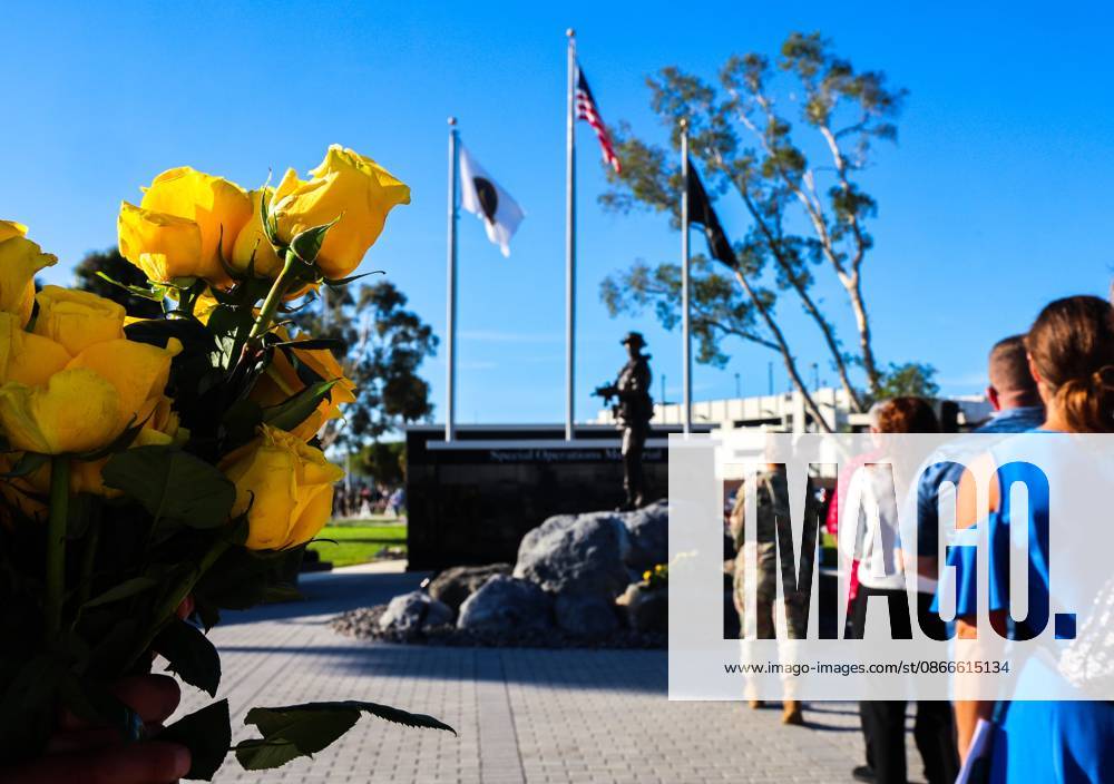 Flowers are distributed to guests in line during the flower tribute at the end of the 9 11 25th Anniversary Memorial Service hosted by U.S. Special Operations Command (USSOCOM) to honor the 25th anniversary of the Sept. 11 terrorist attacks at the MacDill AFB Special Operations Forces Memorial on Friday, Sept. 11, 2026 in Tampa. Tampa USA - ZUMAs70_ 20260911_zan_s70_008