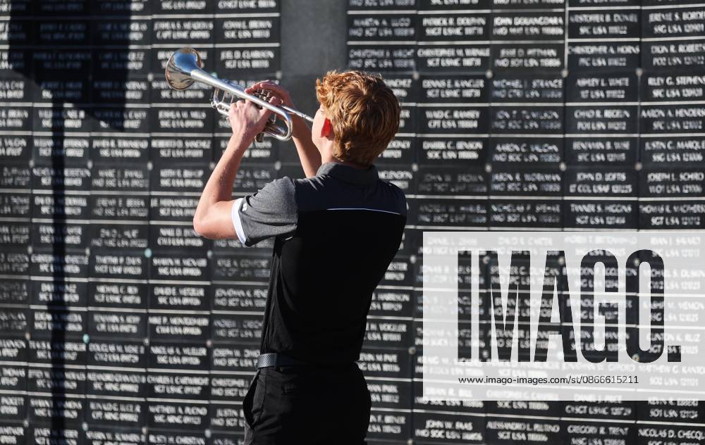 Wilson Poe, with the Berkeley Preparatory School Marching Buccaneers, performs TAPS with the dedicated wall honoring roughly 1,900 fallen special operations service members, in the background, during the 9 11 25th Anniversary Memorial Service hosted by U.S. Special Operations Command (USSOCOM) to honor the 25th anniversary of the Sept. 11 terrorist attacks at the MacDill AFB Special Operations Forces Memorial on Friday, Sept. 11, 2026 in Tampa. Tampa USA - ZUMAs70_ 20260911_zan_s70_015