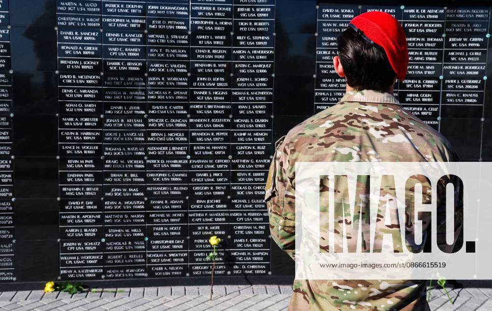 A members of the military community reflects on the dedicated wall honoring roughly 1,900 fallen special operations service members during the 9 11 25th Anniversary Memorial Service hosted by U.S. Special Operations Command (USSOCOM) to honor the 25th anniversary of the Sept. 11 terrorist attacks at the MacDill AFB Special Operations Forces Memorial on Friday, Sept. 11, 2026 in Tampa. Tampa USA - ZUMAs70_ 20260911_zan_s70_011