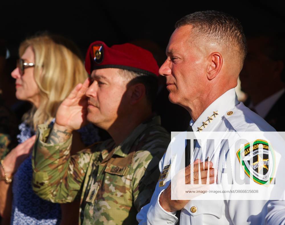 Hillsborough County Sheriff Chad Chronister, on right, stands with his hand on his chest during the National Anthem during the 9 11 25th Anniversary Memorial Service hosted by U.S. Special Operations Command (USSOCOM) to honor the 25th anniversary of the Sept. 11 terrorist attacks at the MacDill AFB Special Operations Forces Memorial on Friday, Sept. 11, 2026 in Tampa. Tampa USA - ZUMAs70_ 20260911_zan_s70_013