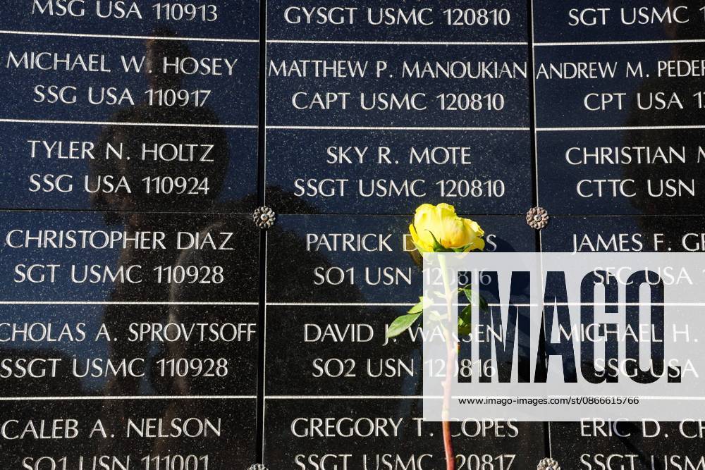 A flower rests against the dedicated wall honoring roughly 1,900 fallen special operations service members during the 9 11 25th Anniversary Memorial Service hosted by U.S. Special Operations Command (USSOCOM) to honor the 25th anniversary of the Sept. 11 terrorist attacks at the MacDill AFB Special Operations Forces Memorial on Friday, Sept. 11, 2026 in Tampa. Tampa USA - ZUMAs70_ 20260911_zan_s70_003