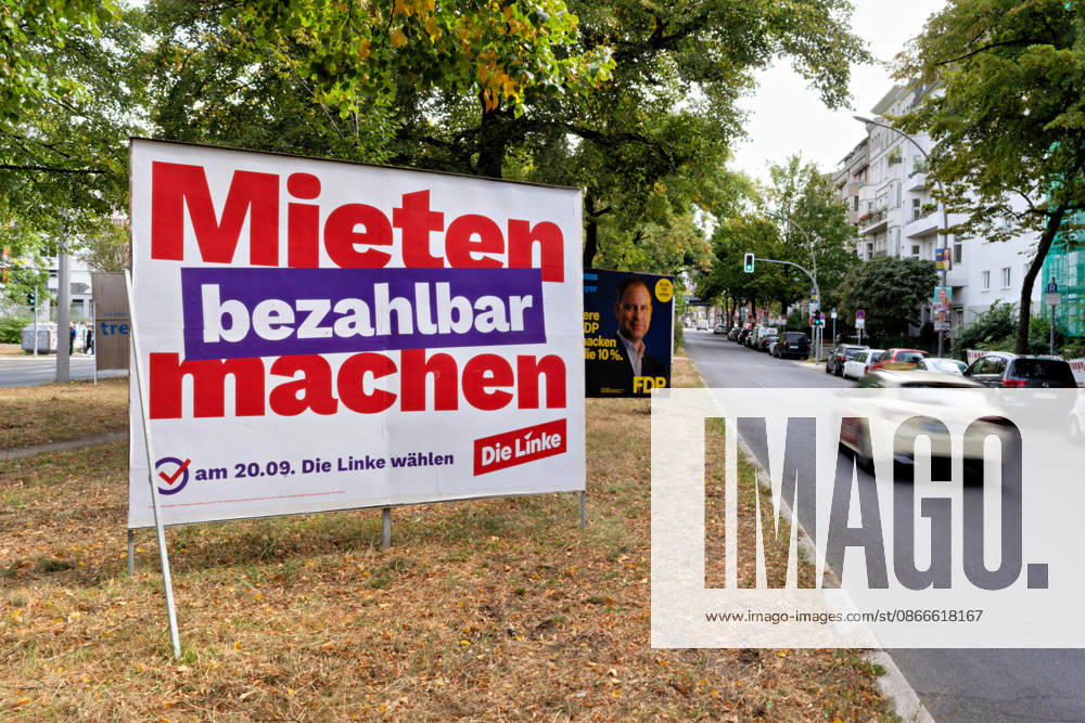 An election poster for the party Die Linke with the slogan Make Rents Affordable stands on the side of the road in Berlin; in the background is an election poster for the FDP. Election posters for Die Linke and the FDP for the Berlin election
