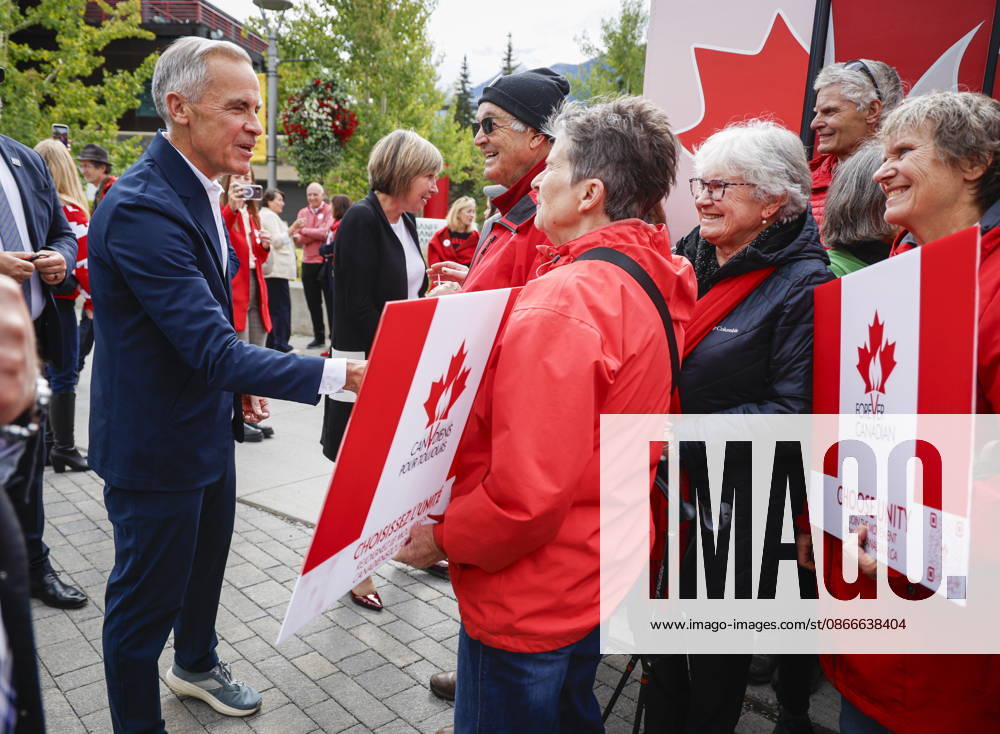 Prime Minister Mark Carney, left, meets with Forever Canadian volunteers following a cabinet retreat in Banff, Alta., Friday, Sept. 11, 2026. Banff CANADA - ZUMAc35_ 20260911_zaf_c35_086