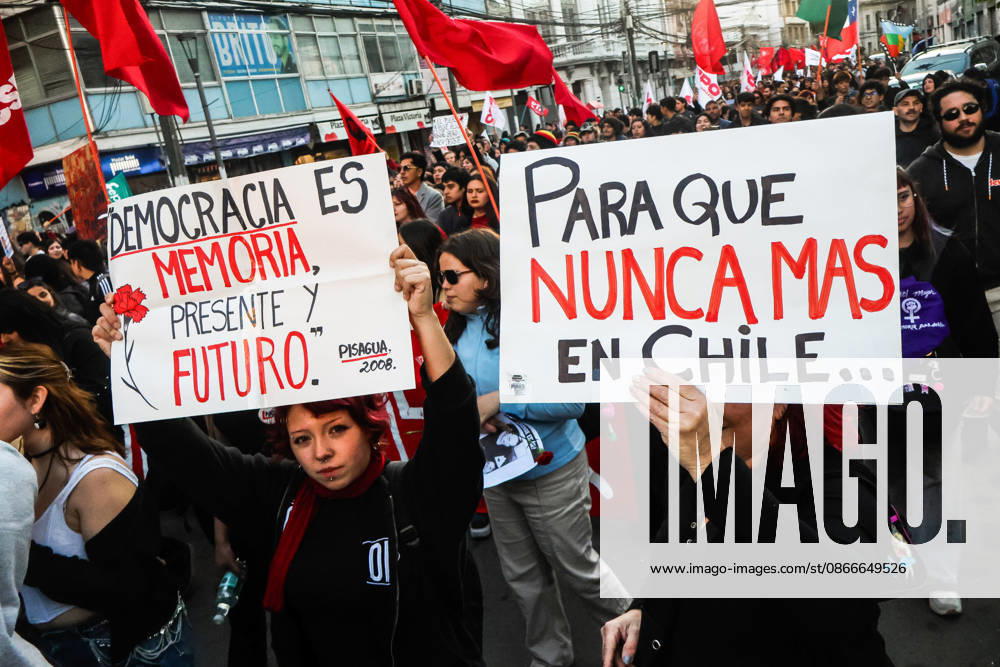Protesters hold placards expressing their opinion during a demonstration march commemorating the 53rd anniversary of the coup d Ãˆtat in ValparaÃaso. Valparaiso Chile - ZUMAs197 20260911_aaa_s197_417
