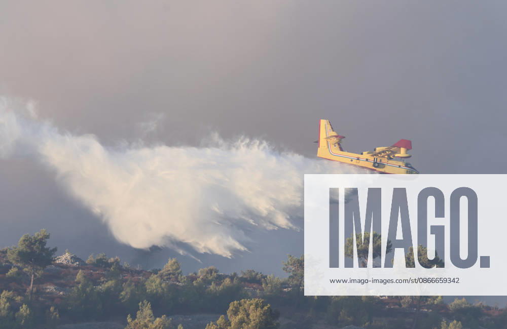 Croatia Island Wildfire A Croatian Canadair CL-415 firefighting plane drops water on a wildfire near city Milna at Island Brac, Croatia on September 12, 2026. IvoxCagalj PIXSELL