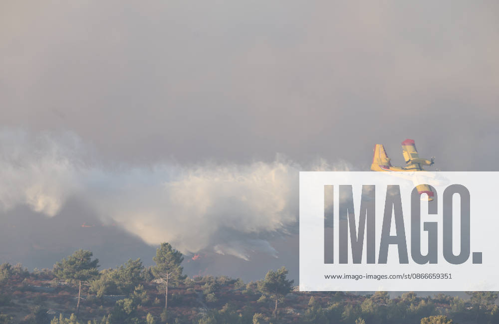 Croatia Island Wildfire A Croatian Canadair CL-415 firefighting plane drops water on a wildfire near city Milna at Island Brac, Croatia on September 12, 2026. IvoxCagalj PIXSELL