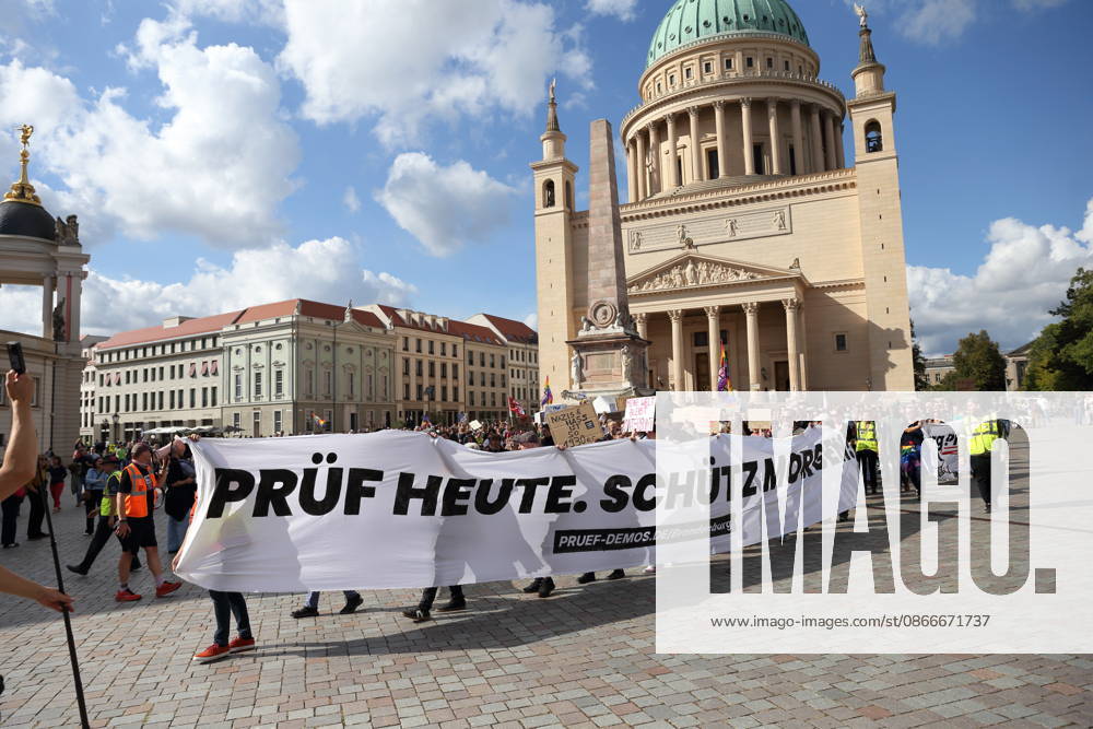 Protesters carrying a banner reading Review today, ban tomorrow march around the state parliament during a demonstration calling for the Federal Constitutional Court to review far-right parties, Alter Markt, Potsdam, September 12, 2026. Review demonstration in Potsdam
