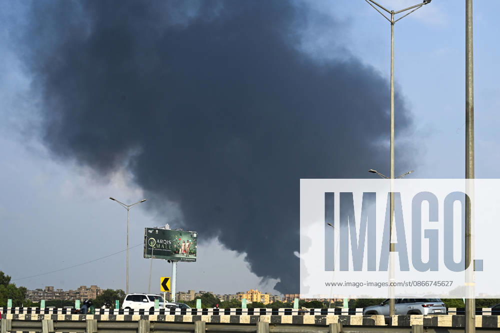 A fire breaks out at a plywood warehouse in Dallupura, East Delhi, sending thick smoke into the sky that is visible from several kilometres away, on September 13, 2026 in New Delhi, India. The fire department received a call about the blaze at 3.20 pm, following which 12 fire tenders were rushed to the spot. Firefighters were present at the site and were working to control the blaze. (Photo by Sanjeev Verma Hindustan Times ) Massive Fire Breaks Out At Delhi Plywood Warehouse, 12 Fire Tenders Rushed