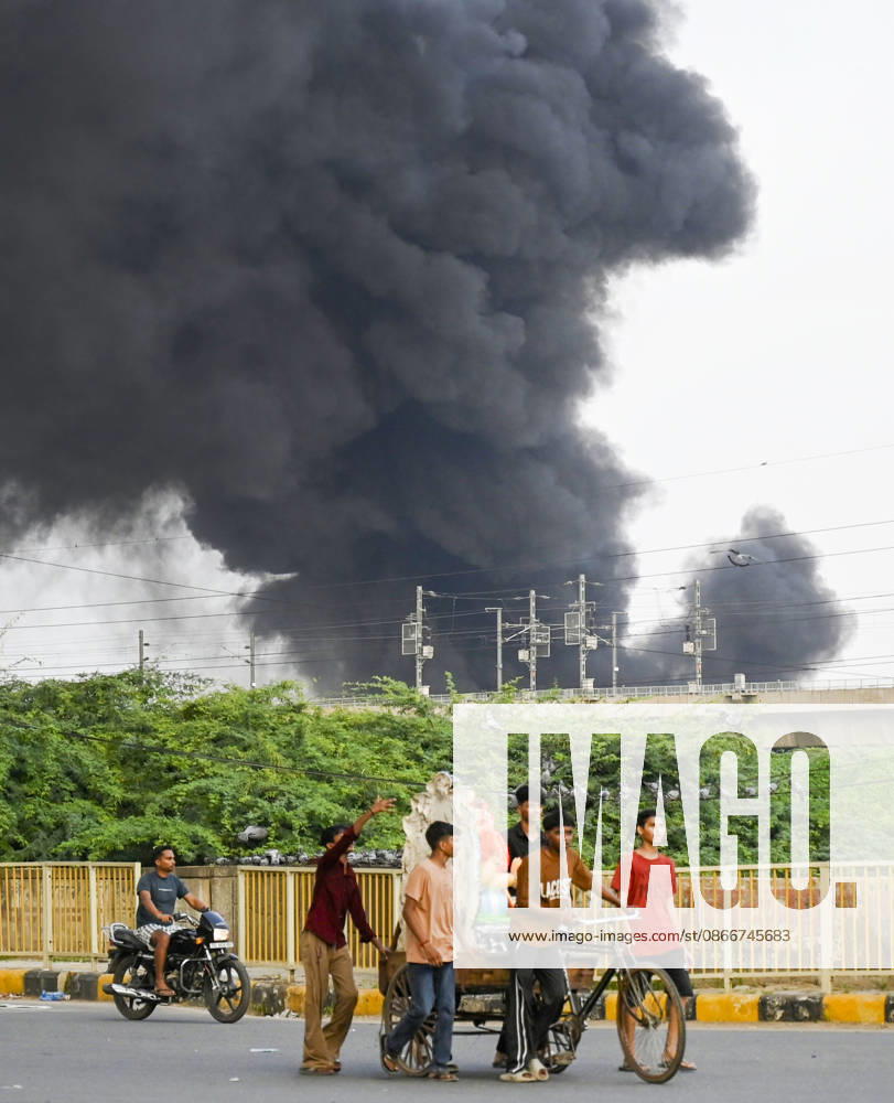 A fire breaks out at a plywood warehouse in Dallupura, East Delhi, sending thick smoke into the sky that is visible from several kilometres away, on September 13, 2026 in New Delhi, India. The fire department received a call about the blaze at 3.20 pm, following which 12 fire tenders were rushed to the spot. Firefighters were present at the site and were working to control the blaze. (Photo by Sanjeev Verma Hindustan Times ) Massive Fire Breaks Out At Delhi Plywood Warehouse, 12 Fire Tenders Rushed
