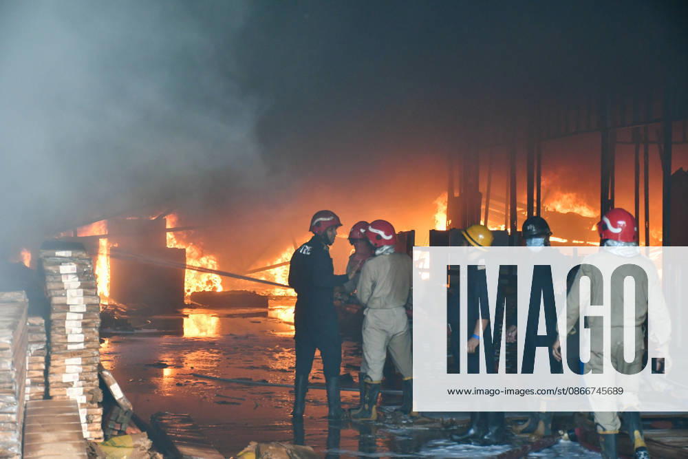 Firefighters work to extinguish a massive blaze at a plywood warehouse in Dallupura, East Delhi, as thick plumes of smoke billow into the sky and remain visible from several kilometres away, on September 13, 2026 in New Delhi, India. The fire department received a call about the blaze at 3.20 pm, following which 12 fire tenders were rushed to the spot. Firefighters were present at the site and were working to control the blaze. (Photo by Sanjeev Verma Hindustan Times ) Massive Fire Breaks Out At Delhi Plywood Warehouse, 12 Fire Tenders Rushed
