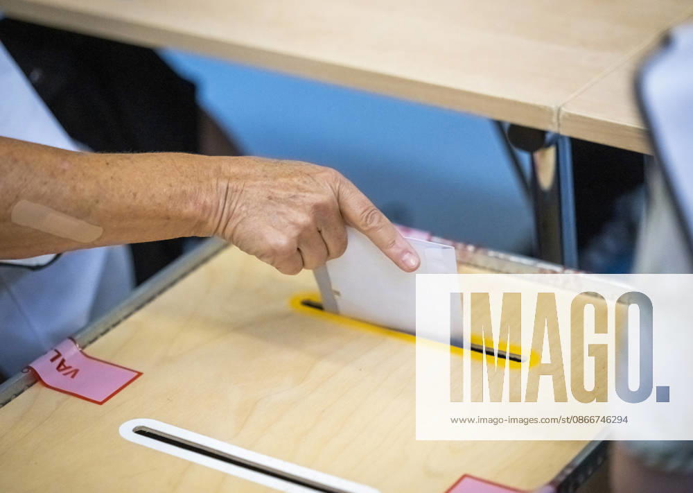 A ballot envelope containing a yellow vote for the parliamentary election is placed in the ballot box at the polling place at Västervangskolan in Landskrona on Election Day, September 13, 2026. LANDSKRONA, SWEDEN