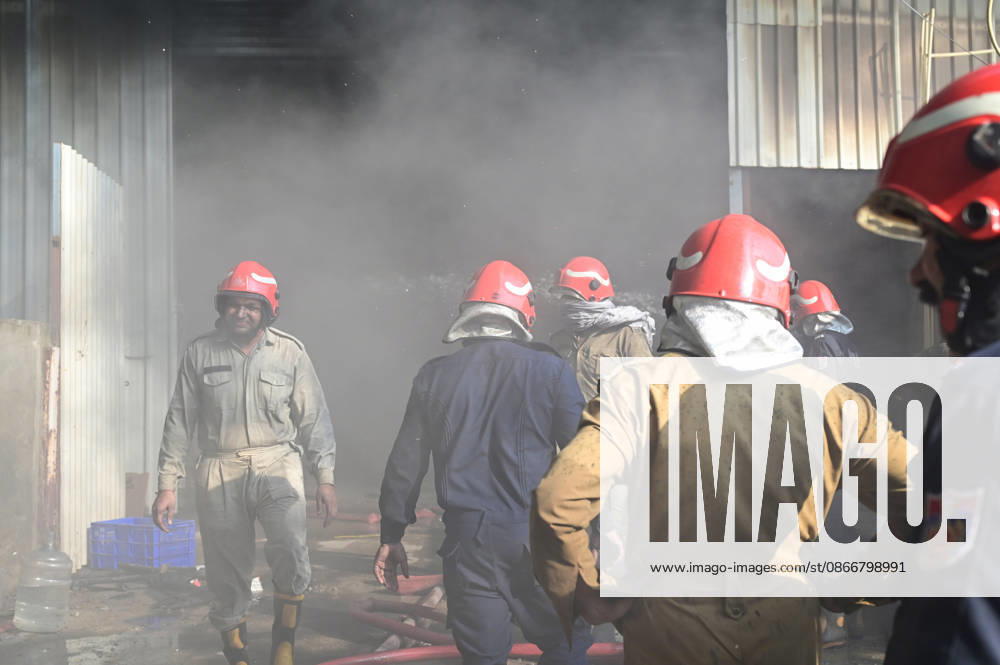 Firefighters work to extinguish a massive blaze at a plywood warehouse in Dallupura, East Delhi, as thick plumes of smoke billow into the sky and remain visible from several kilometres away, on September 13, 2026 in New Delhi, India. The fire department received a call about the blaze at 3.20 pm, following which 12 fire tenders were rushed to the spot. Firefighters were present at the site and were working to control the blaze. (Photo by Sunil Ghosh Hindustan Times ) Massive Fire Breaks Out At Delhi Plywood Warehouse, 12 Fire Tenders Rushed