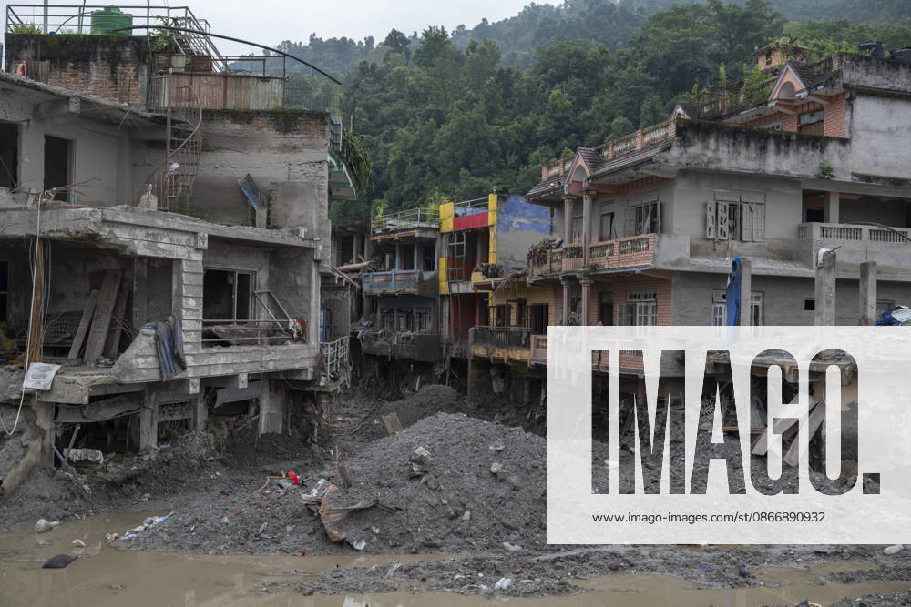 Aftermath of the devastating flash floods in Nepal NUWAKOT, NEPAL - SEPTEMBER 15: A view of the submerged landscape following the devastating flash floods on August 26 that struck Devighat, Nuwakot, Nepal, on September 15, 2026. People in the affected areas of Nuwakot continue to return in search of their destroyed homes and the last remaining memories of their lives. Some are trying to recover essential belongings from the rubble, while others are working with family members to remove soil from parts of their homes buried underground and make them habitable again. The destruction in Devighat village is severe. Many multi-storey buildings have collapsed, while some have been buried under earth up to the level of their fifth floors. Religiou