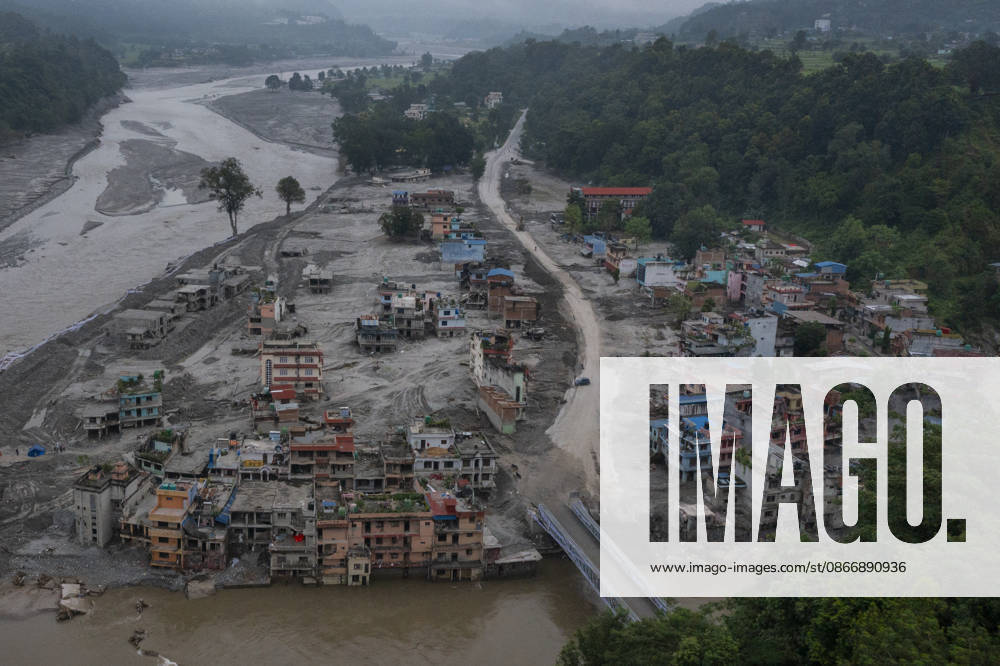 Aftermath of the devastating flash floods in Nepal NUWAKOT, NEPAL - SEPTEMBER 15: A view of the submerged landscape following the devastating flash floods on August 26 that struck Devighat, Nuwakot, Nepal, on September 15, 2026. People in the affected areas of Nuwakot continue to return in search of their destroyed homes and the last remaining memories of their lives. Some are trying to recover essential belongings from the rubble, while others are working with family members to remove soil from parts of their homes buried underground and make them habitable again. The destruction in Devighat village is severe. Many multi-storey buildings have collapsed, while some have been buried under earth up to the level of their fifth floors. Religiou