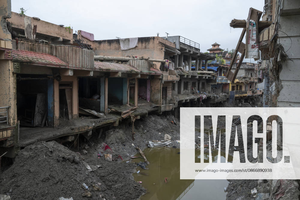 Aftermath of the devastating flash floods in Nepal NUWAKOT, NEPAL - SEPTEMBER 15: A view of the submerged landscape following the devastating flash floods on August 26 that struck Devighat, Nuwakot, Nepal, on September 15, 2026. People in the affected areas of Nuwakot continue to return in search of their destroyed homes and the last remaining memories of their lives. Some are trying to recover essential belongings from the rubble, while others are working with family members to remove soil from parts of their homes buried underground and make them habitable again. The destruction in Devighat village is severe. Many multi-storey buildings have collapsed, while some have been buried under earth up to the level of their fifth floors. Religiou