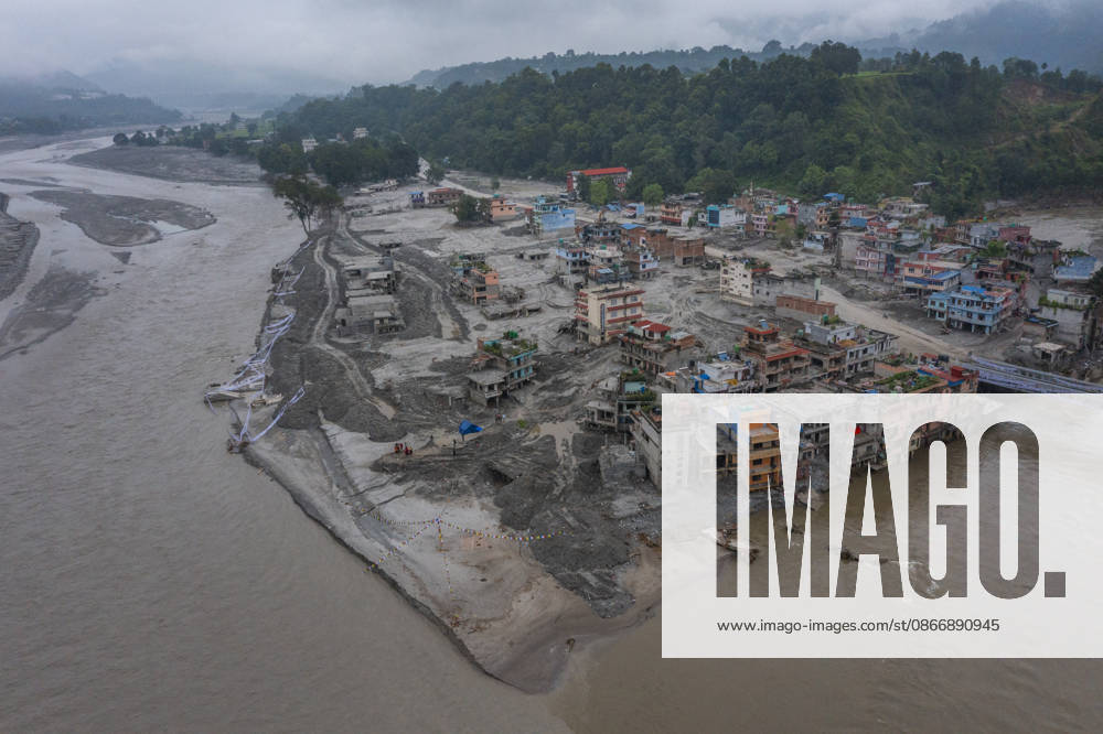 Aftermath of the devastating flash floods in Nepal NUWAKOT, NEPAL - SEPTEMBER 15: A view of the destruction following the devastating flash floods on August 26 that struck Devighat, Nuwakot, Nepal, on September 15, 2026. People in the affected areas of Nuwakot continue to return in search of their destroyed homes and the last remaining memories of their lives. Some are trying to recover essential belongings from the rubble, while others are working with family members to remove soil from parts of their homes buried underground and make them habitable again. The destruction in Devighat village is severe. Many multi-storey buildings have collapsed, while some have been buried under earth up to the level of their fifth floors. Religious figure