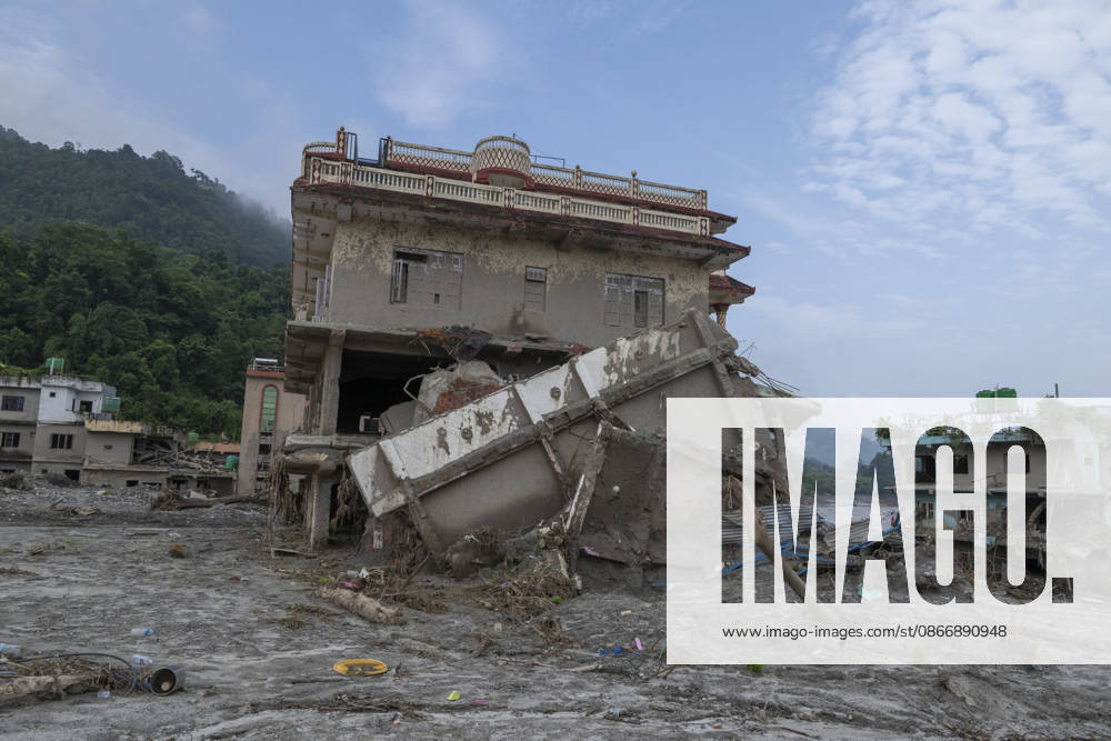 Aftermath of the devastating flash floods in Nepal NUWAKOT, NEPAL - SEPTEMBER 15: A view of the submerged landscape following the devastating flash floods on August 26 that struck Devighat, Nuwakot, Nepal, on September 15, 2026. People in the affected areas of Nuwakot continue to return in search of their destroyed homes and the last remaining memories of their lives. Some are trying to recover essential belongings from the rubble, while others are working with family members to remove soil from parts of their homes buried underground and make them habitable again. The destruction in Devighat village is severe. Many multi-storey buildings have collapsed, while some have been buried under earth up to the level of their fifth floors. Religiou
