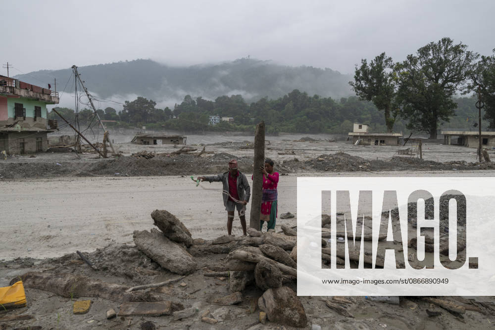 Aftermath of the devastating flash floods in Nepal NUWAKOT, NEPAL - SEPTEMBER 15: A view of the submerged landscape following the devastating flash floods on August 26 that struck Devighat, Nuwakot, Nepal, on September 15, 2026. People in the affected areas of Nuwakot continue to return in search of their destroyed homes and the last remaining memories of their lives. Some are trying to recover essential belongings from the rubble, while others are working with family members to remove soil from parts of their homes buried underground and make them habitable again. The destruction in Devighat village is severe. Many multi-storey buildings have collapsed, while some have been buried under earth up to the level of their fifth floors. Religiou