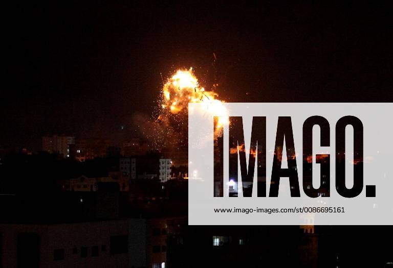 Gaza City, Gaza Strip, Palestinian Territory - A picture taken on November 12, 2018, shows a ball of fire and smoke rise above the building housing the television station al-Aqsa TV during an Israeli air strike in Gaza City. Israel s military said it was carrying out air strikes throughout the Gaza Strip after a barrage of rocket fire from the Palestinian Gaza Strip towards Israel. The flare-up follows a clash that erupted during an Israeli special forces operation in the Gaza Strip the previous night that killed eight people of Hamas movement Gaza City Palestinian Territory - ZUMAap3_ 20181112_zaf_ap3_235