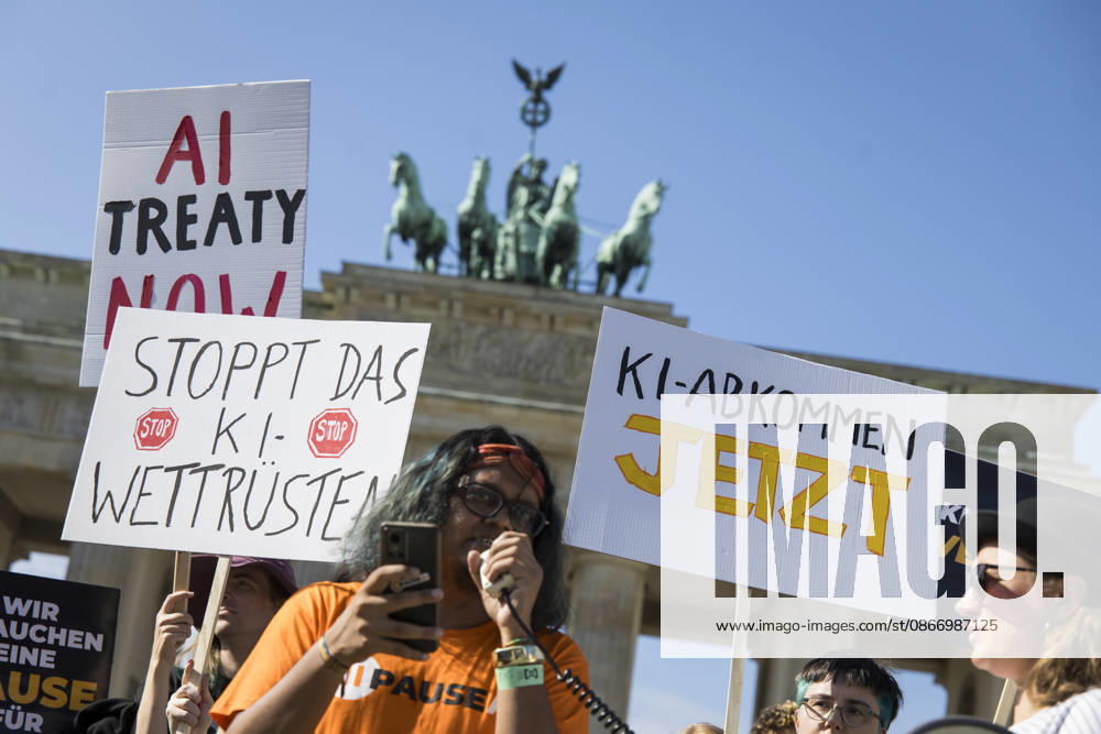 Pause AI, demonstration in front of the Brandenburg Gate, Berlin, September 15, 2026. Members holding signs reading AI Treaty Now and Stop the AI Arms Race and AI Treaty Now to call for a pause in AI development during a demonstration by the Pause AI movement in front of the Brandenburg Gate, Berlin, September 15, 2026; Berlin, Brandenburg Gate