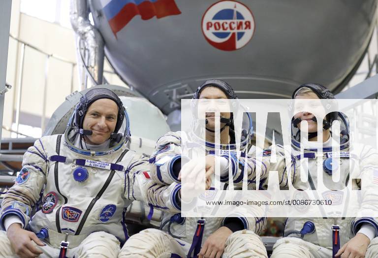 MOSCOW REGION, RUSSIA â€“ NOVEMBER 14, 2018: Canadian Space Agency (CSA) astronaut David Saint-Jacques, Roscosmos cosmonaut Oleg Kononenko, and NASA astronaut Anne McClain (L-R) in spacesuits by the TDK-7ST3 simulator as they attend qualification training session for the upcoming mission to the International Space Station, at the Yuri Gagarin Cosmonaut Training Centre in Zvyozdny Gorodok Star City , Moscow Region. The launch of Expedition 58 59 aboard the Soyuz MS-11 spacecraft to the ISS is scheduled for December 3, 2018. Mikhail Japaridze TASS TS0974DB