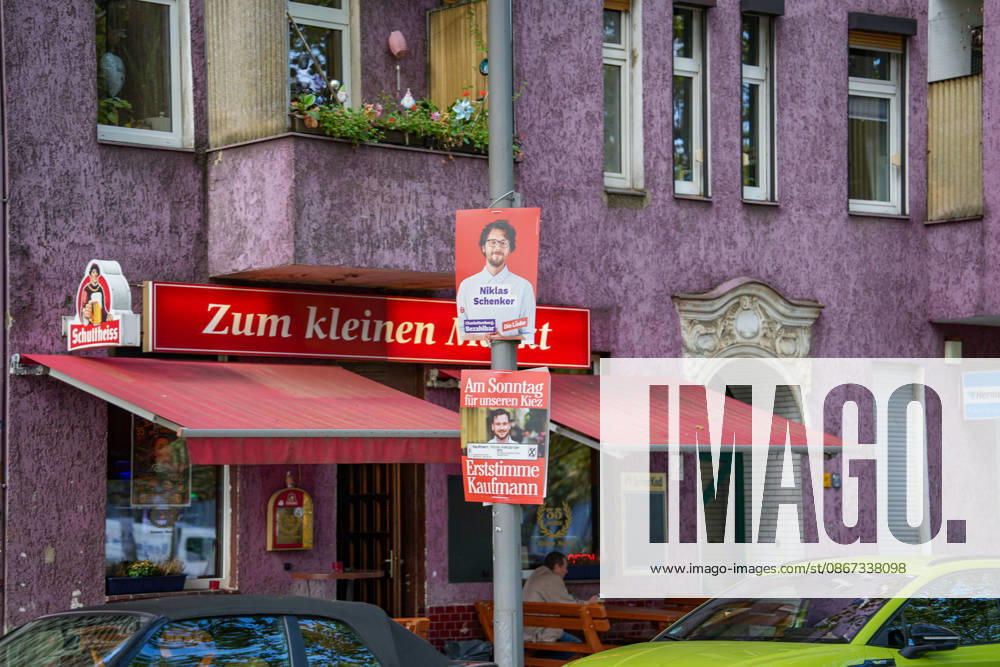 Berlin, Germany, September 20, 2026: Election poster for Die Linke candidate Niklas Schenker in the Berlin House of Representatives election, displayed in front of a Berlin corner bar. Die Linke, Niklas Schenker, campaign poster, Berlin election, House of Representatives election, 2026 election, election campaign, political parties, neighborhood, corner bar, dining scene, citysca