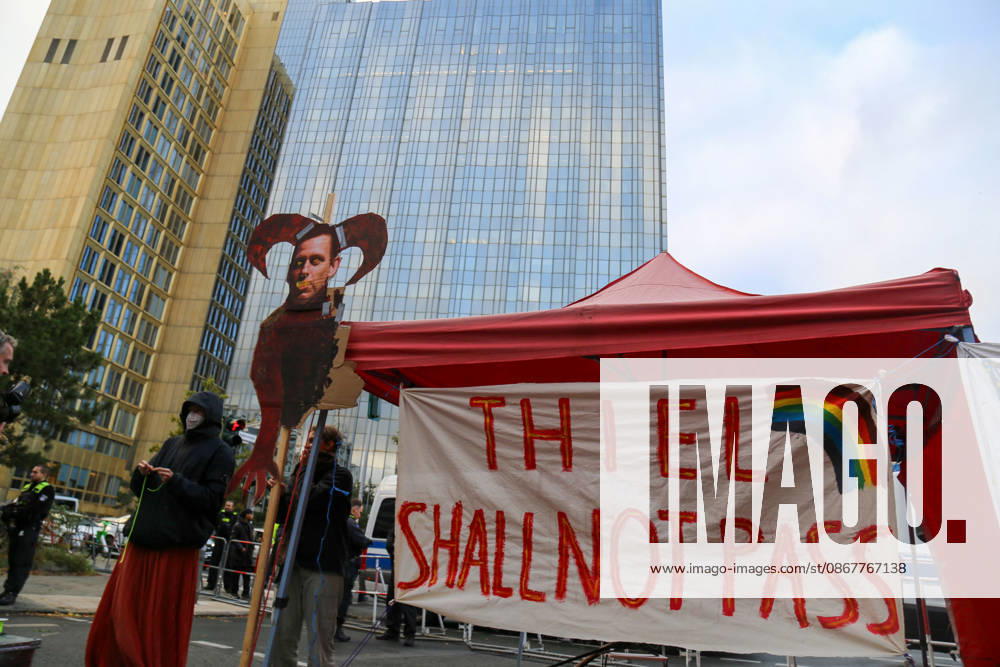 Berlin, Germany, September 24, 2026: Protest in front of the Axel Springer Tower against the presentation of the Axel Springer Award to Peter Thiel. Pictured are a banner reading THIEL SHALL NOT PASS featuring a rainbow, as well as a caricature of Thiel with horns. Demonstration, protest